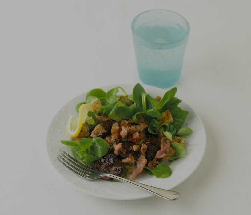 Sauteed duck livers with shallots pancetta lambs lettuce